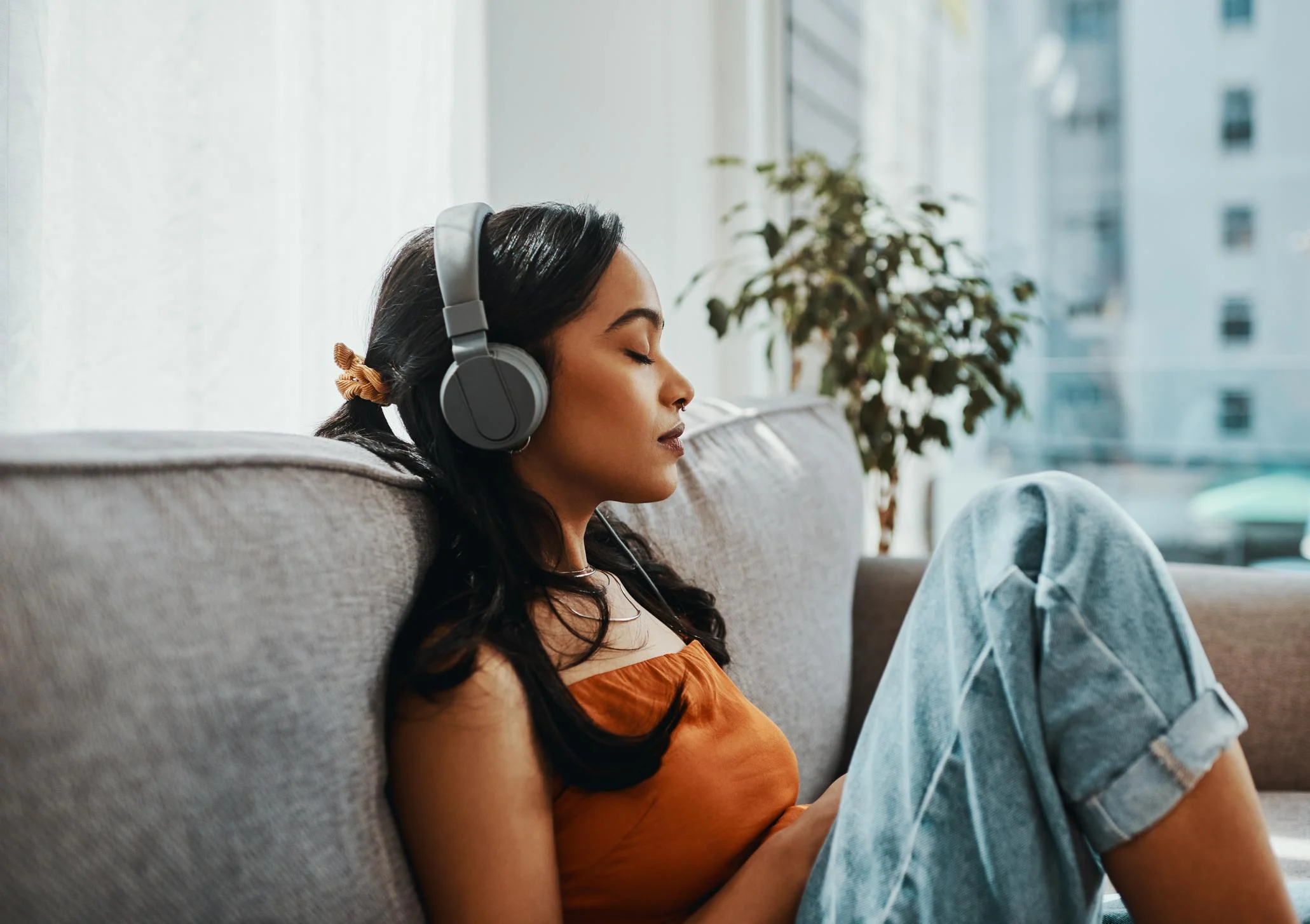 Woman-listening-to-music-in-headphones-music-relaxation-for-stress